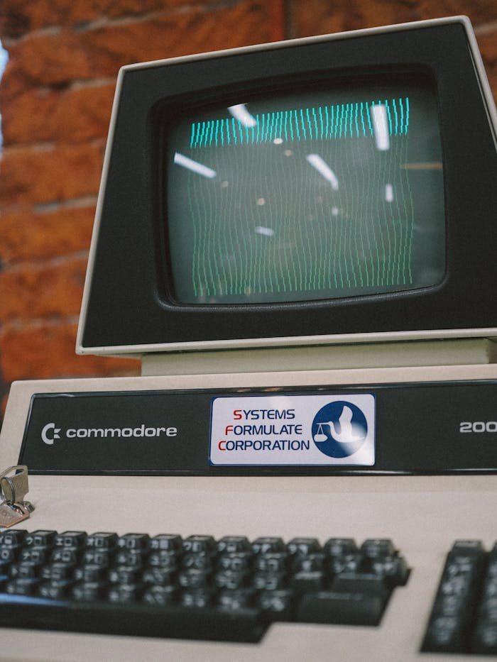 Close-up of a vintage Commodore computer with a CRT monitor and keyboard, showing retro technology.